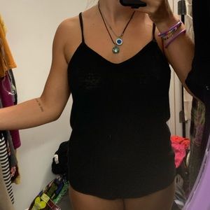 black tank top with cross-cross straps in the back
